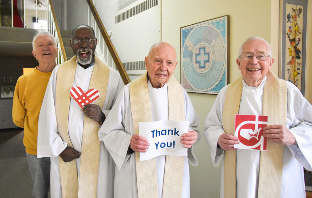 Four Catholic Glenmary priests smile in a spirit of Thanksgiving.