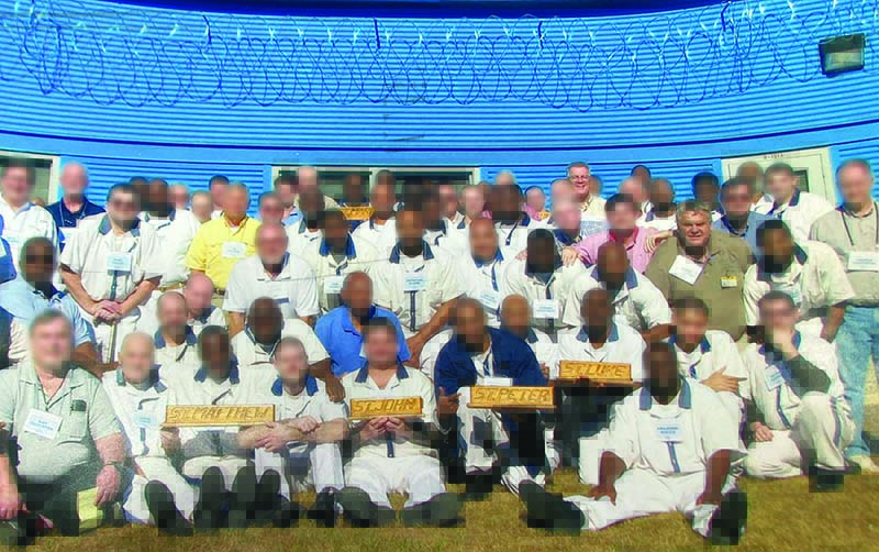 Prison ministry photo. This shows inmates and Catholic volunteers at a Georgia prison retreat.