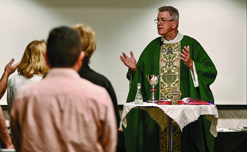 Prison ministry and marriage ministry are the focus of Father François' work. Here he says Mass at a marriage event.